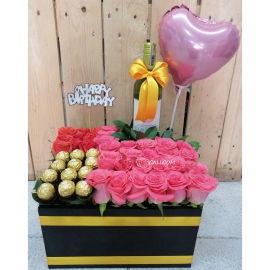 Cubo de rosas chocolates y vino en cali